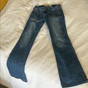 Hollister Women's Ultra Low-Rise Boot Jeans in Deep Blue